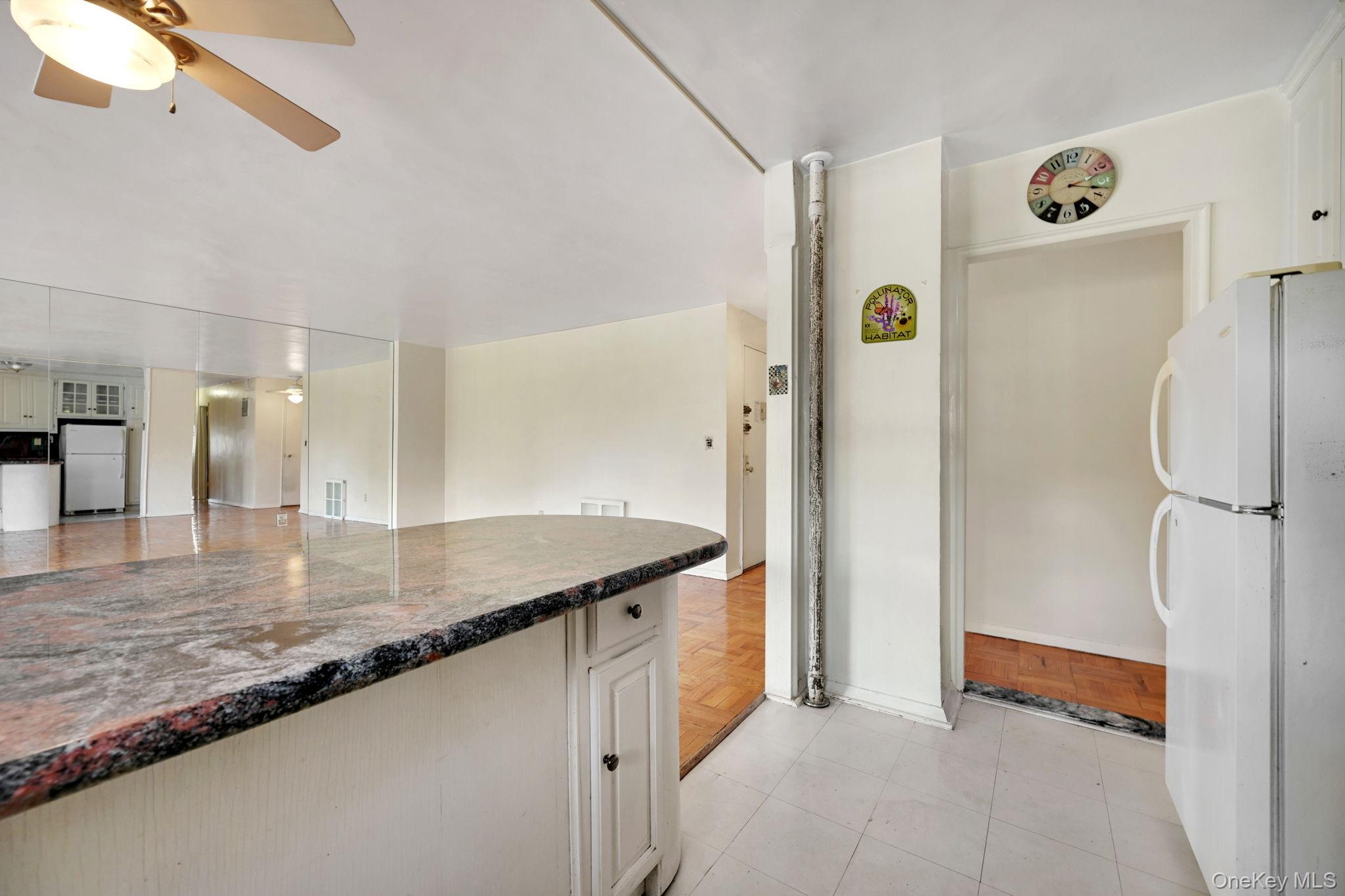 3131 Grand Concourse, Unit 3C Bronx, NY 10468 - Photo 18 of 27 a kitchen with stainless steel appliances granite countertop a refrigerator and a sink
