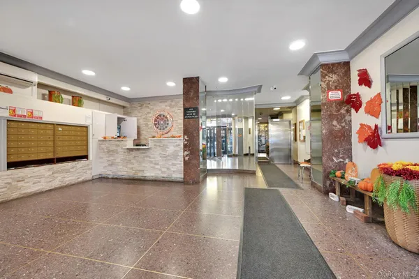 a view of a lobby with furniture and floor to ceiling window