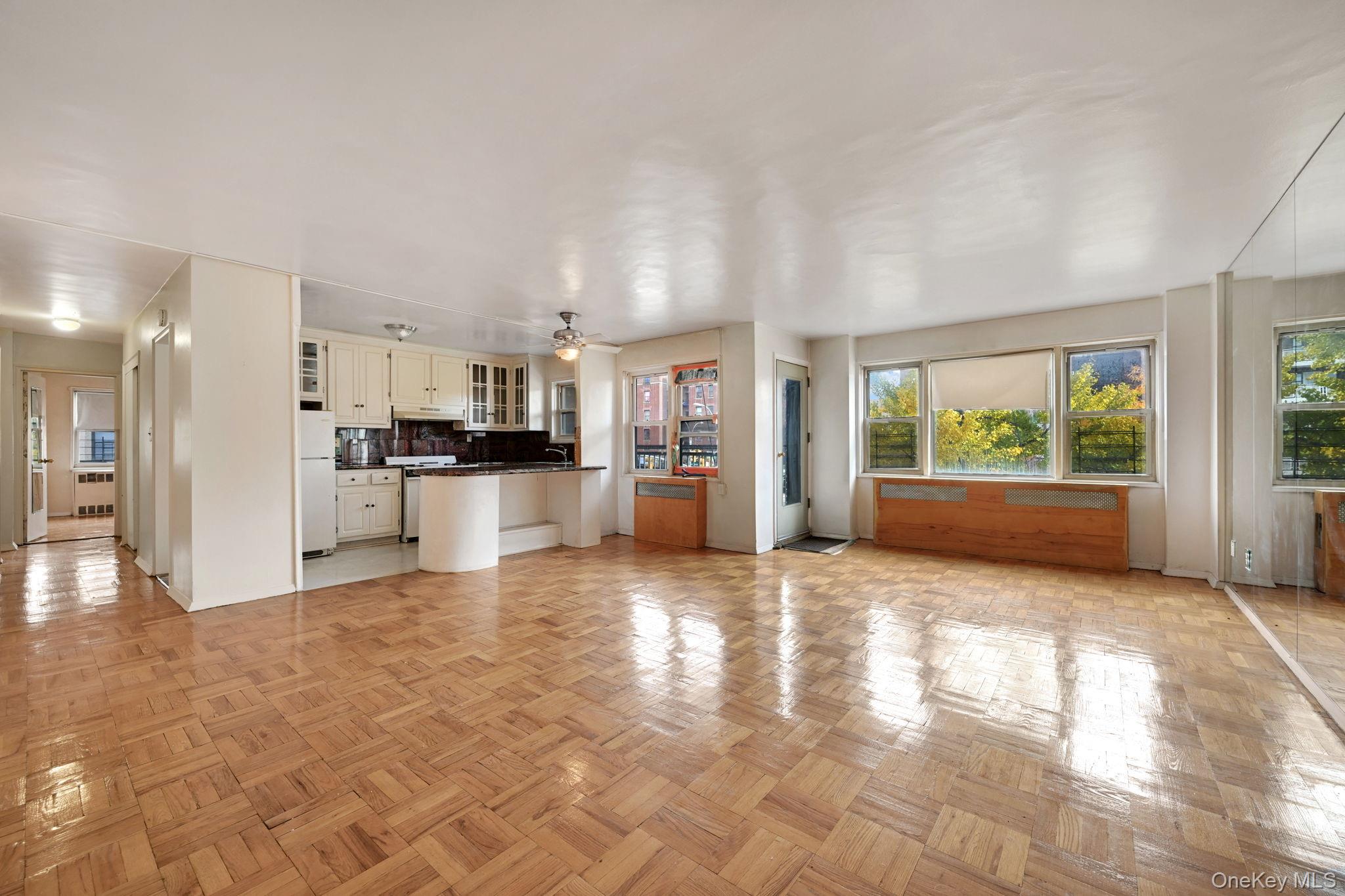 3131 Grand Concourse, Unit 3C Bronx, NY 10468 - Photo 4 of 27 a view of a kitchen with refrigerator and windows
