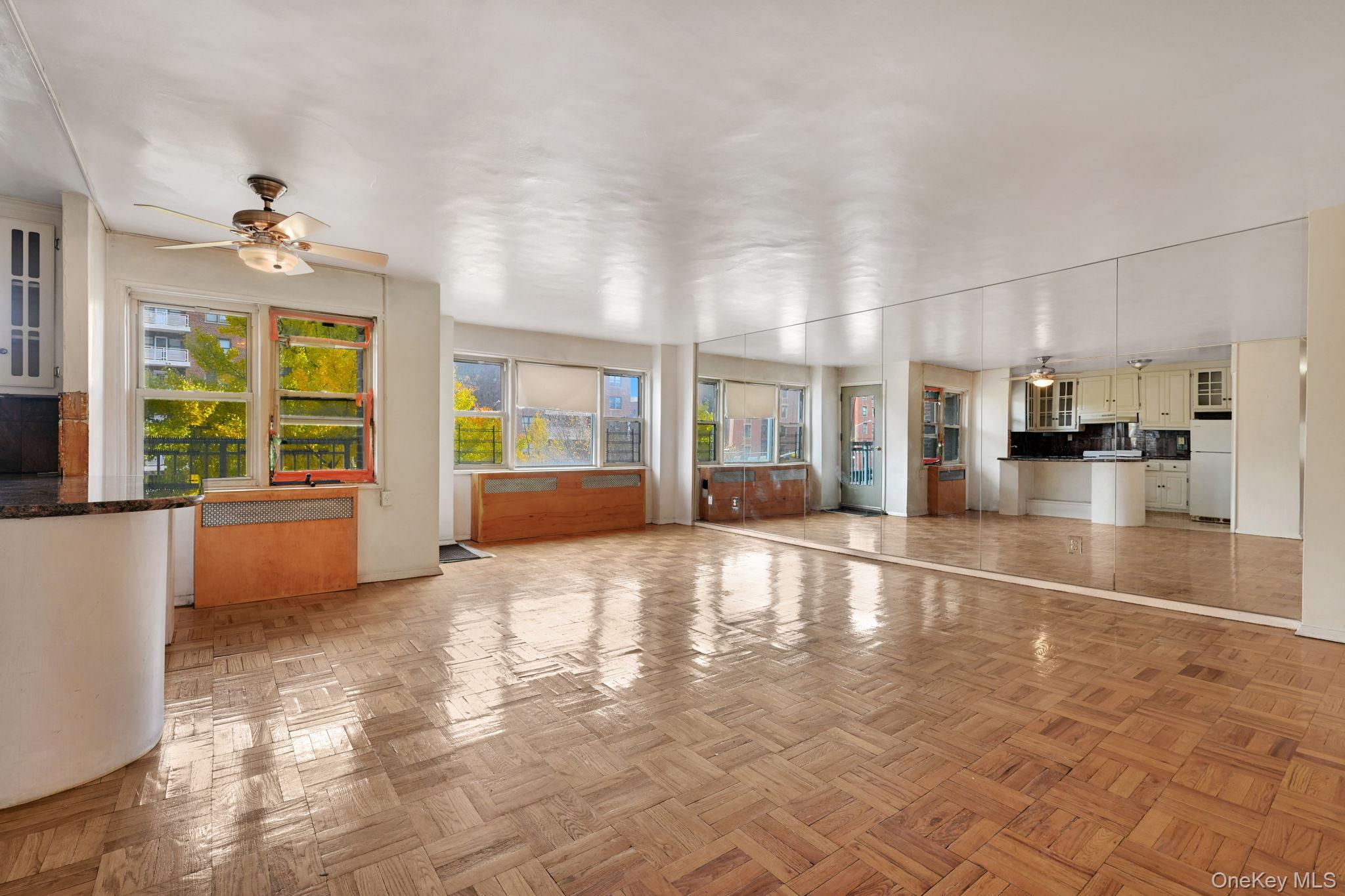 3131 Grand Concourse, Unit 3C Bronx, NY 10468 - Photo 5 of 27 a view of an entryway with wooden floors and windows