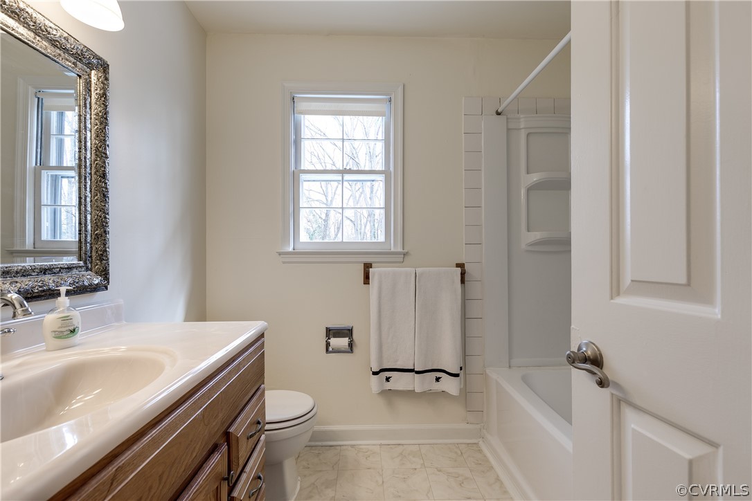 4025 Hidden Valley Road Chester, VA 23831 - Photo 14 of 23 a bathroom with a sink a toilet and shower