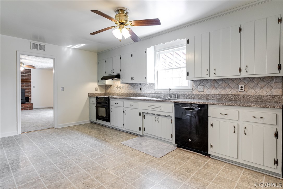 4025 Hidden Valley Road Chester, VA 23831 - Photo 8 of 23 a kitchen with granite countertop a sink cabinets stainless steel appliances and a window