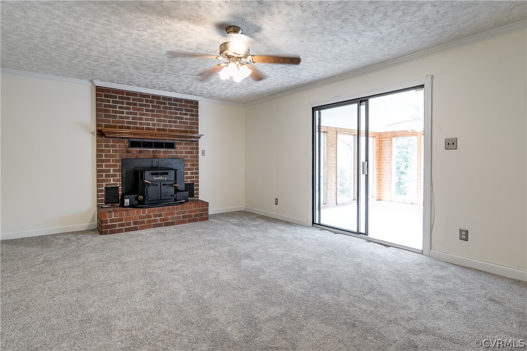 4025 Hidden Valley Road Chester, VA 23831 - Photo 10 of 23 an empty room with chandelier fan and windows