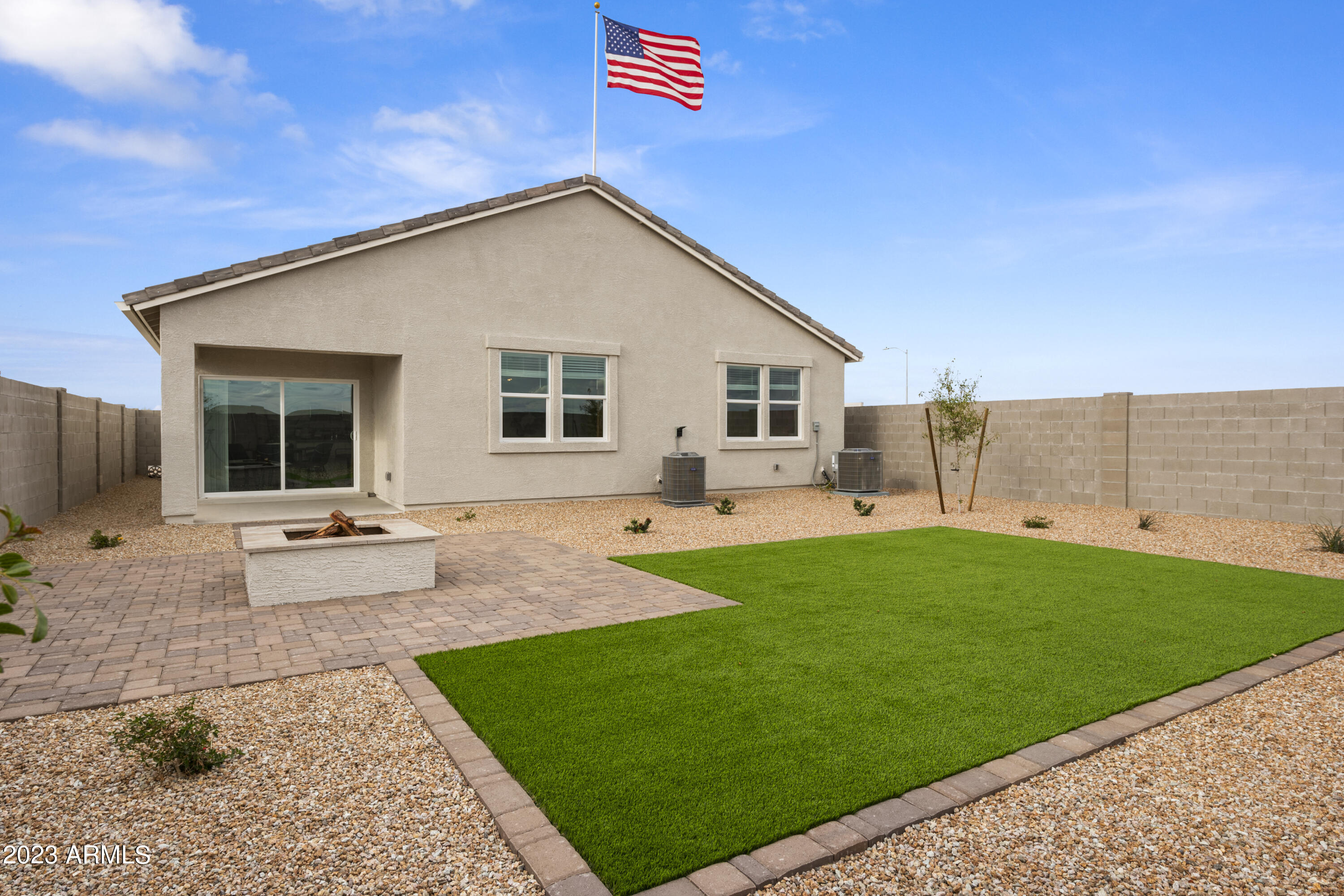 2374 West Solstice Avenue Apache Junction, AZ 85120 - Photo 9 of 59 a view of a house with backyard and sitting area