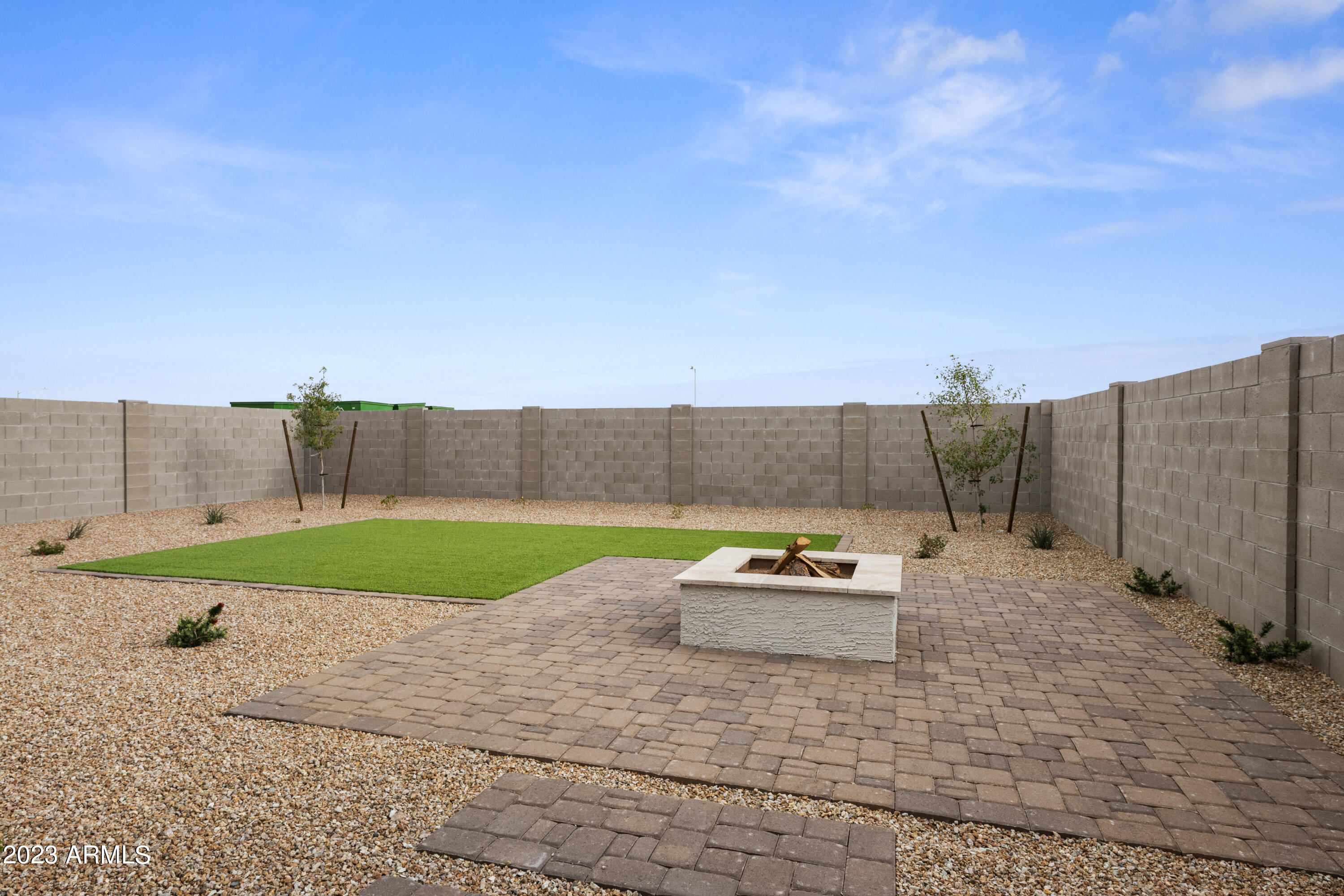 2374 West Solstice Avenue Apache Junction, AZ 85120 - Photo 10 of 59 a backyard of a house with lots of green space