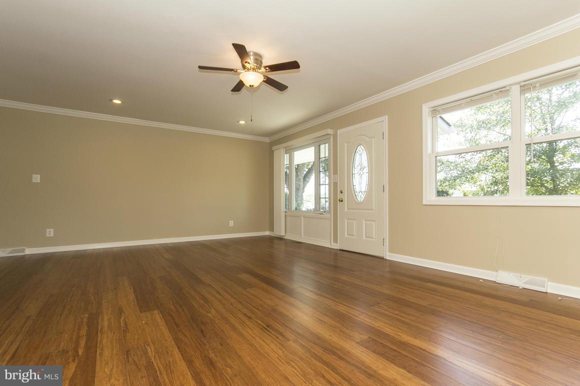 2100 Bayberry Road Edgewood, MD 21040 - Photo 3 of 30 a view of an empty room with wooden floor and a window