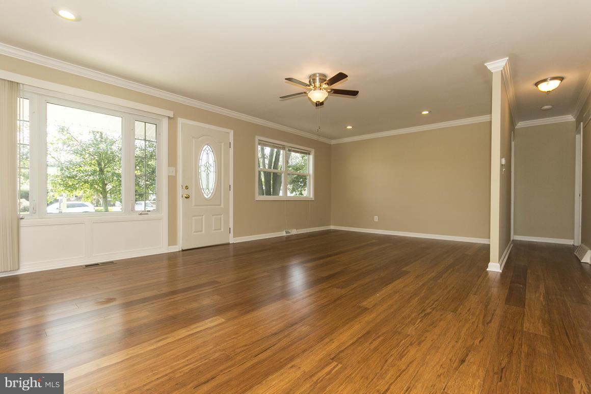 2100 Bayberry Road Edgewood, MD 21040 - Photo 4 of 30 a view of an empty room with wooden floor and a window