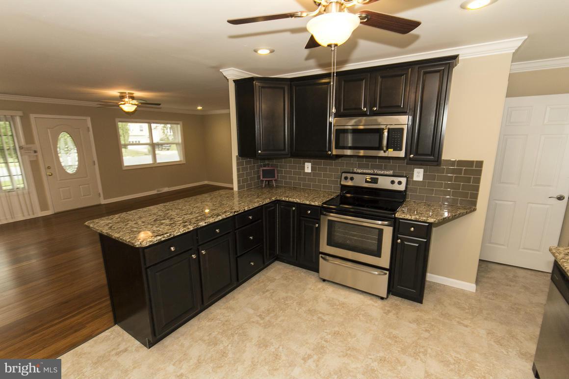 2100 Bayberry Road Edgewood, MD 21040 - Photo 8 of 30 a kitchen with a stove and a microwave