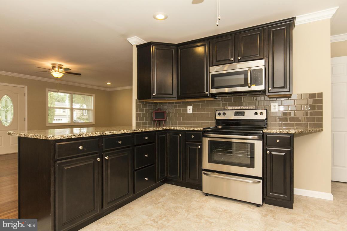 2100 Bayberry Road Edgewood, MD 21040 - Photo 9 of 30 a kitchen with a sink stove and microwave