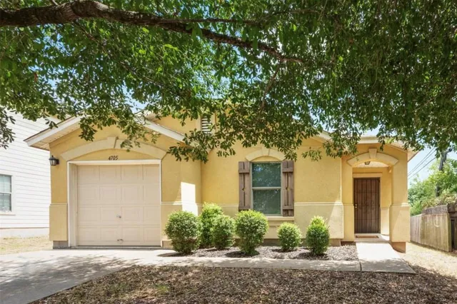 front view of a house with a trees