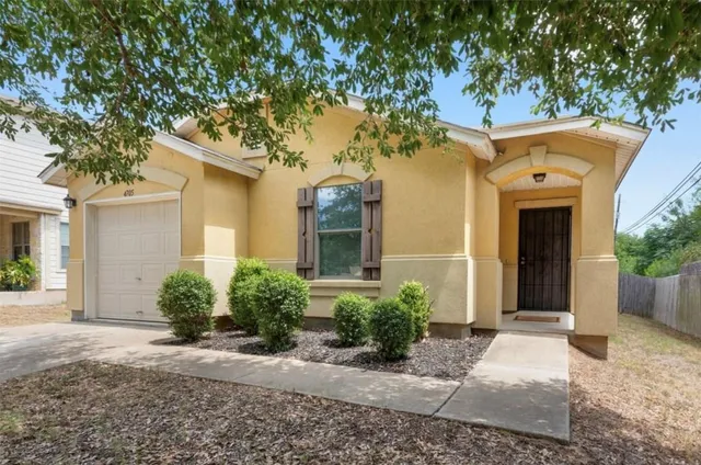 front view of a house with a small yard