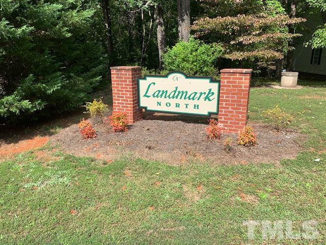 13 Landmark North Roxboro, NC 27573 - Photo 1 of 5 a sign board with a house and yard in the back