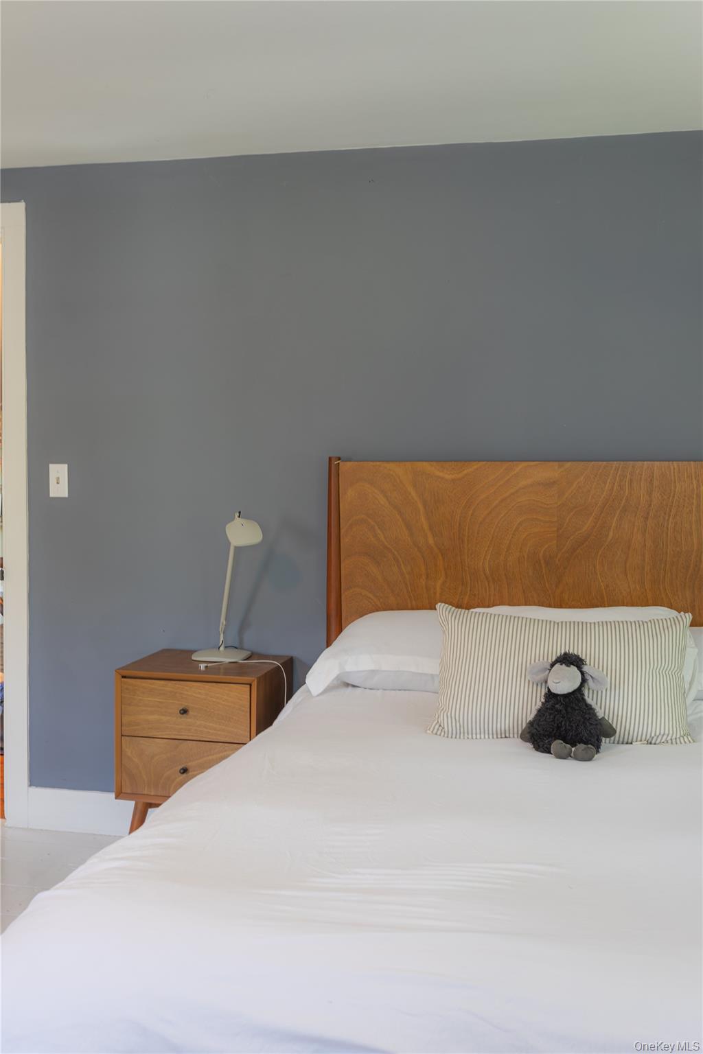 210 Middle Road Hudson, NY 12534 - Photo 32 of 42 Primary Bedroom featuring a Queen size wood-finish headboard, painted walls, and wood-finish nightstand with two drawers