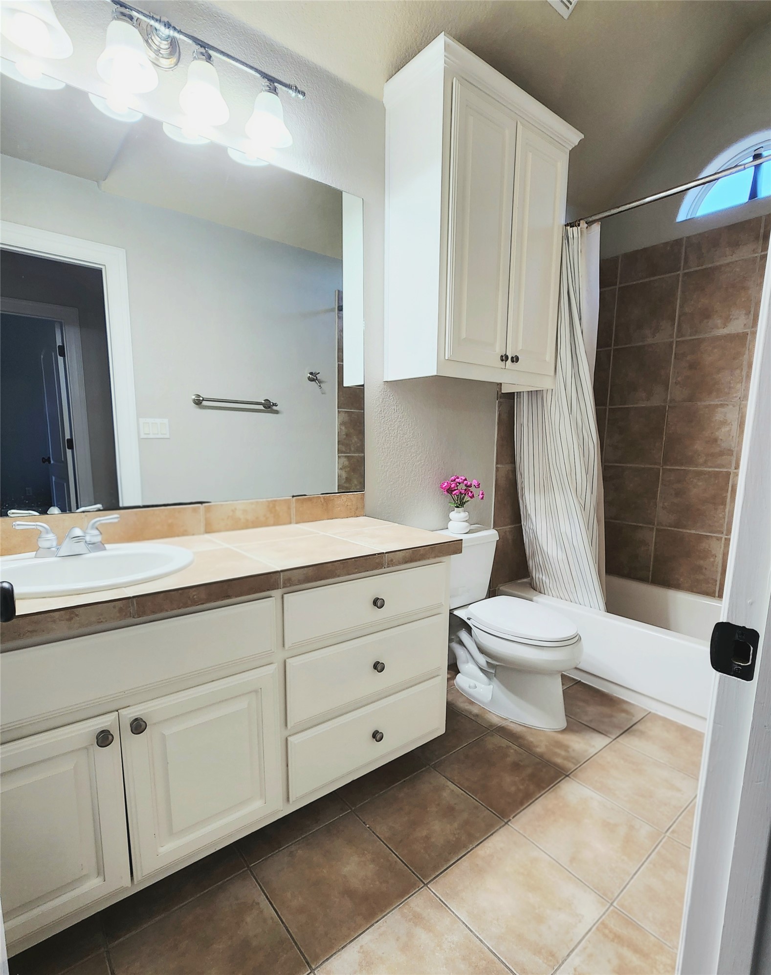 152 Silver Hawk Court Dripping Springs, TX 78620 - Photo 25 of 31 a spacious bathroom with a double vanity sink and a mirror