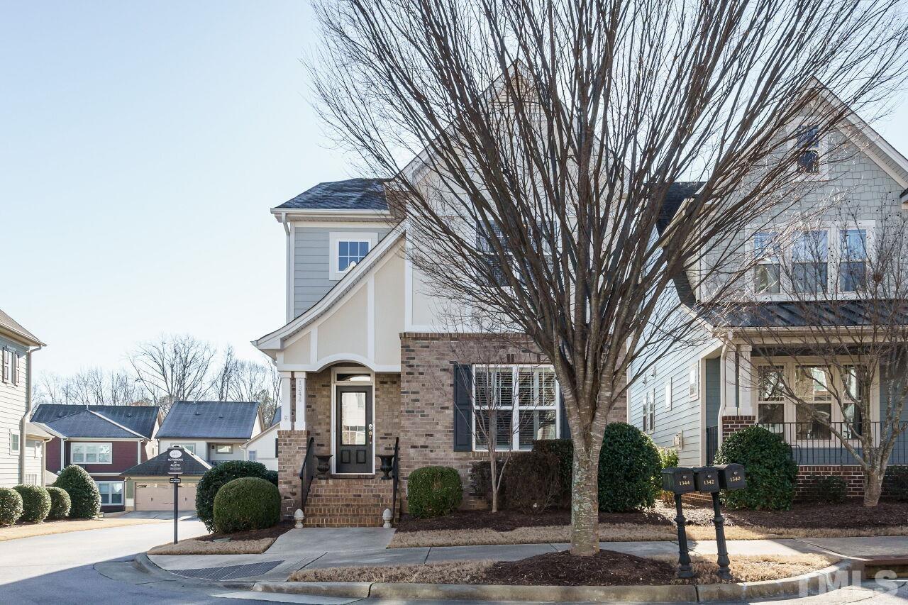 1344 Rodessa Run Raleigh, NC 27607 - Photo 2 of 38 a front view of a house with a tree