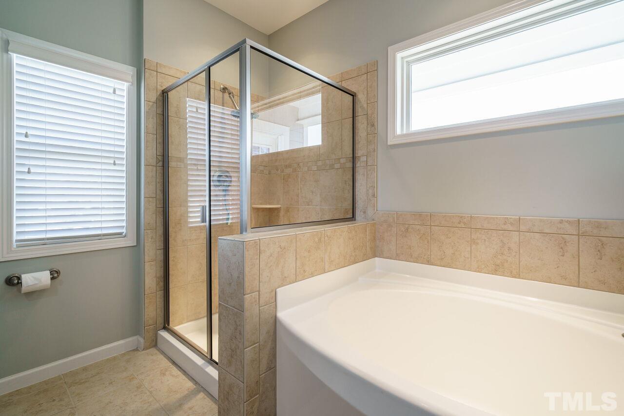 1344 Rodessa Run Raleigh, NC 27607 - Photo 28 of 38 a bedroom with a bed and a window