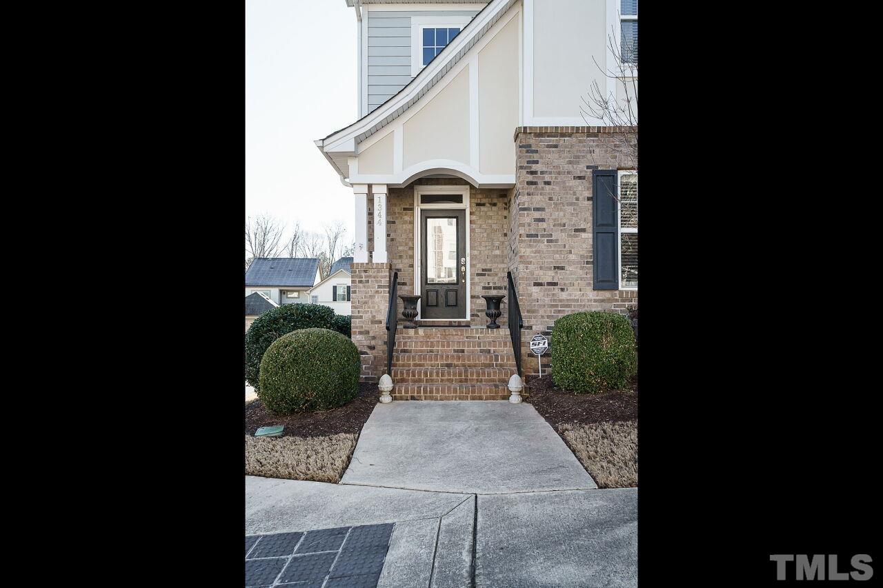 1344 Rodessa Run Raleigh, NC 27607 - Photo 3 of 38 a front view of a house with garden