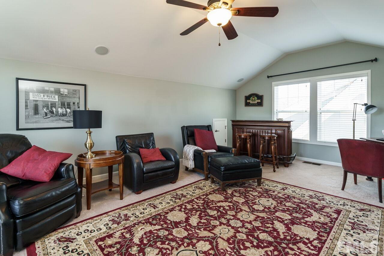 1344 Rodessa Run Raleigh, NC 27607 - Photo 33 of 38 a living room with furniture and a fireplace