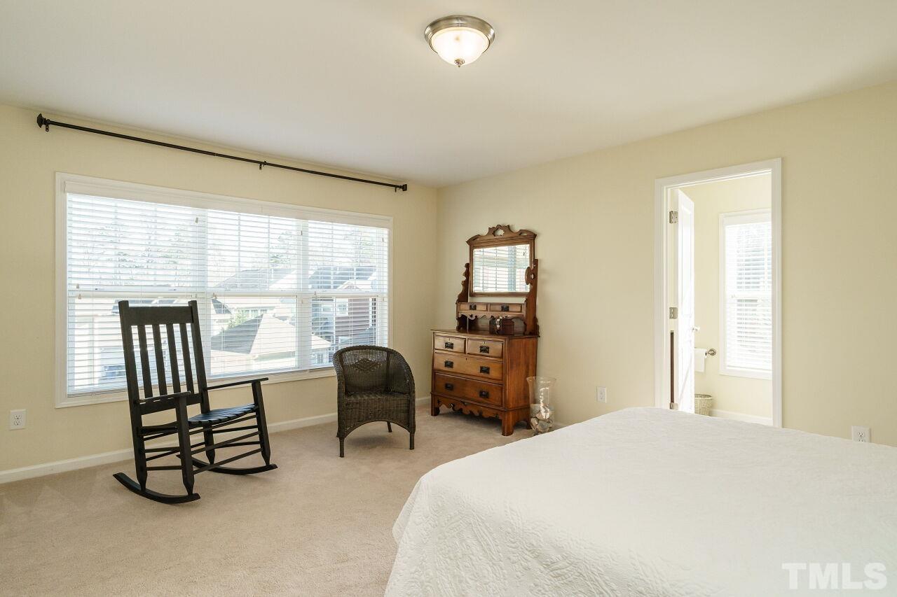 1344 Rodessa Run Raleigh, NC 27607 - Photo 35 of 38 a bedroom with a bed and a large window