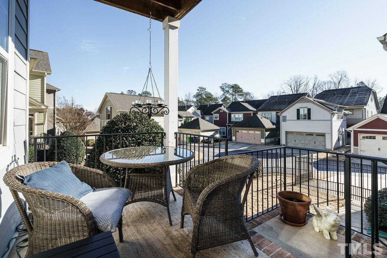 1344 Rodessa Run Raleigh, NC 27607 - Photo 37 of 38 a view of a patio with couches table and chairs and potted plants