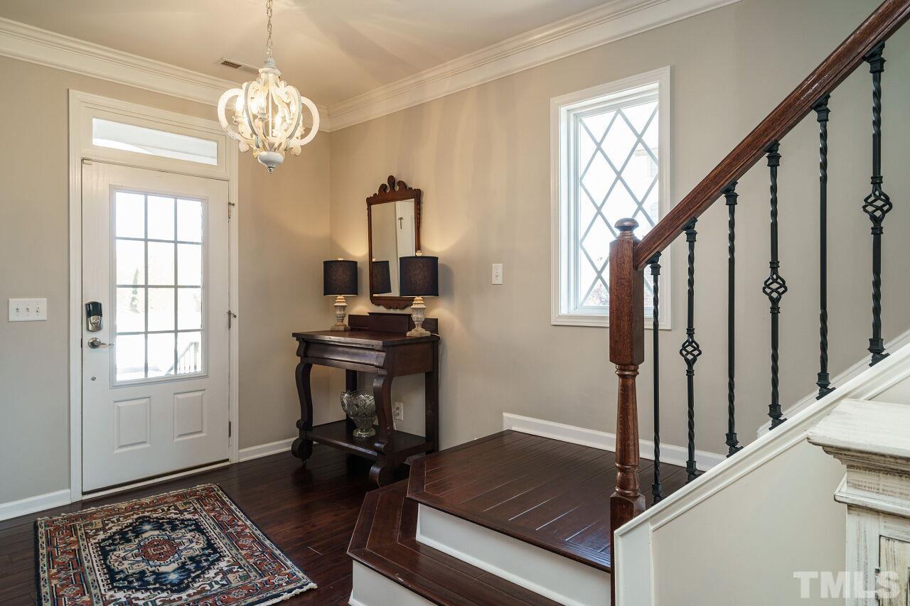 1344 Rodessa Run Raleigh, NC 27607 - Photo 4 of 38 a living room with wooden floor and a window