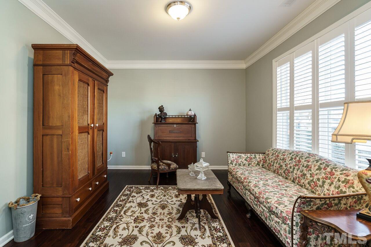 1344 Rodessa Run Raleigh, NC 27607 - Photo 7 of 38 a bedroom with a bed and wooden floor