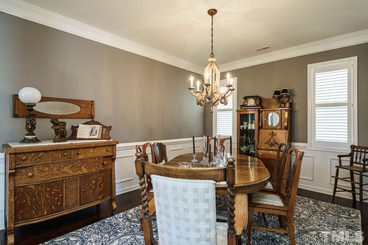 1344 Rodessa Run Raleigh, NC 27607 - Photo 8 of 38 a view of a dining room with furniture and chandelier