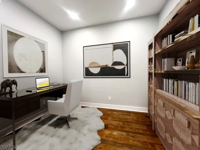 a living room with fish tank and a book shelf