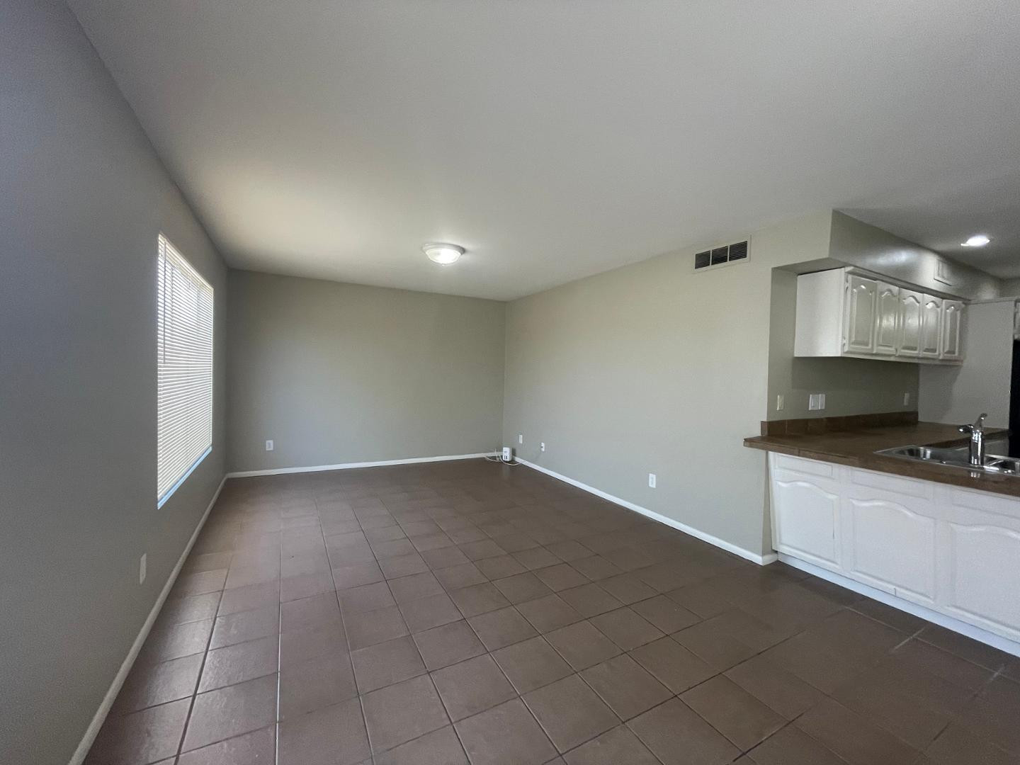 10902 West Montecito Avenue Phoenix, AZ 85037 - Photo 9 of 22 a view of a kitchen with a sink and a stove top oven
