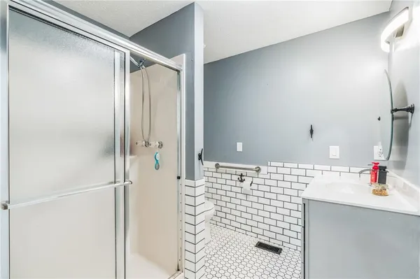 a bathroom with a bathtub and a shower