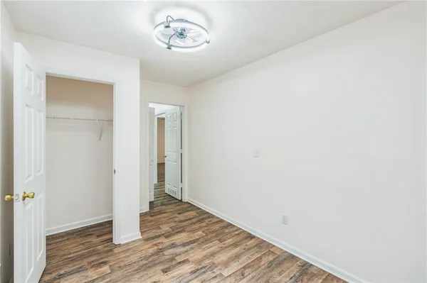 a front view of house with a garden