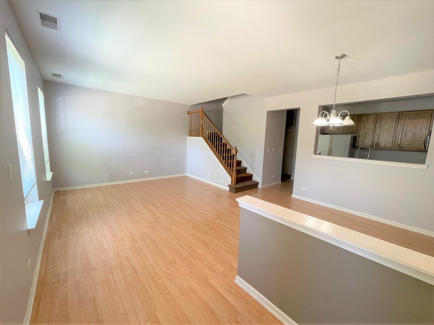 2463 Georgetown Circle Aurora, IL 60503 - Photo 3 of 21 a view of a kitchen with furniture and wooden floor
