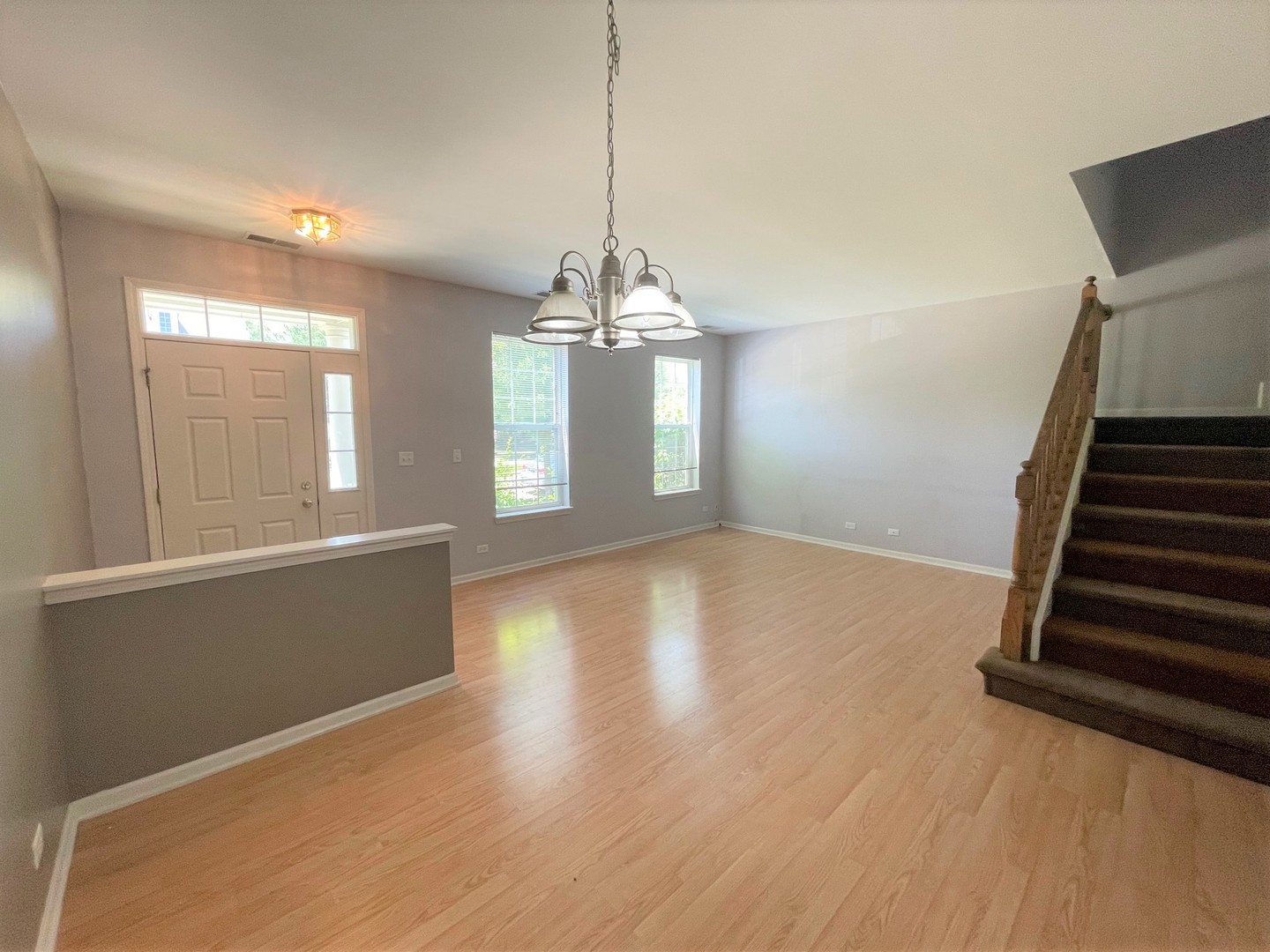 2463 Georgetown Circle Aurora, IL 60503 - Photo 4 of 21 wooden floor in an empty room with a window