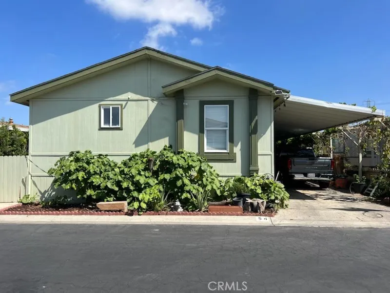 1616 South Euclid Street, Unit 54 Anaheim, CA 92802 - Photo 1 of 11 a front view of a house with a yard