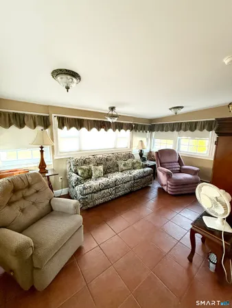 a living room with furniture and a window