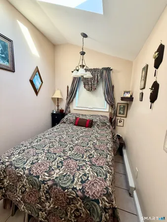 a bedroom with a bed and cabinets