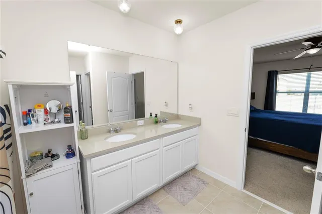 a bathroom with a sink a vanity and a mirror