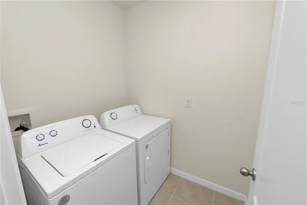 a bedroom with a bed and a chair