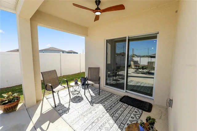 a bedroom with a bed and a chair