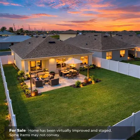 a house view with swimming pool and yard