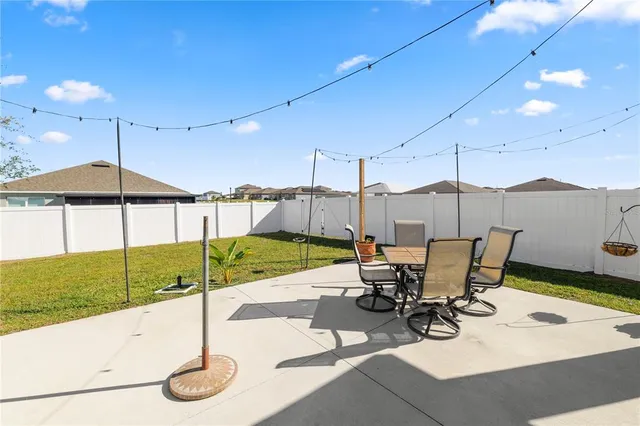 a view of a swimming pool with chairs