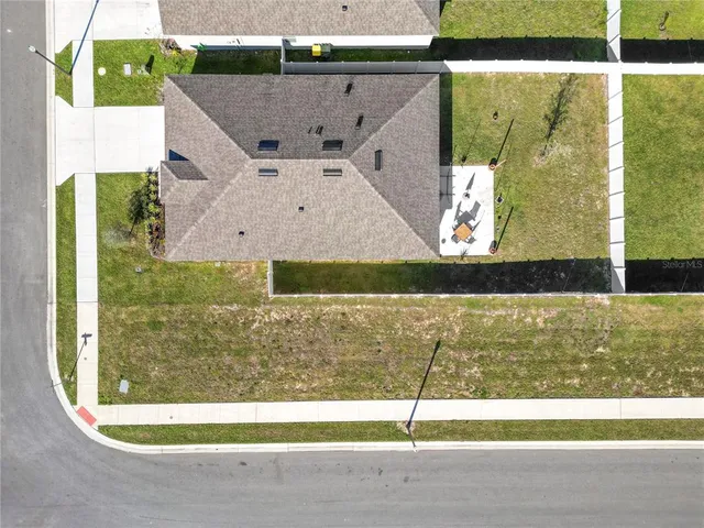 a view of a swimming pool with a lake from a sink