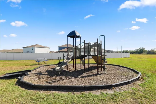 an aerial view of a house with a swimming pool