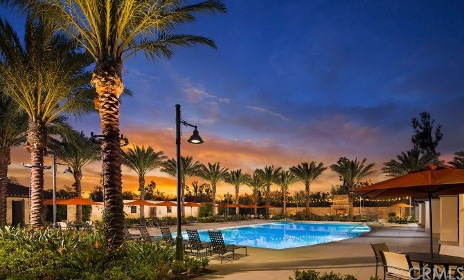 65 Rockinghorse Irvine, CA 92602 - Photo 2 of 2 a view of a yard with swimming pool and an outdoor seating