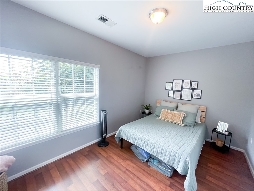 190 Eli Hartley Drive, Unit 112 Boone, NC 28607 - Photo 15 of 20 a bedroom with a bed and a window