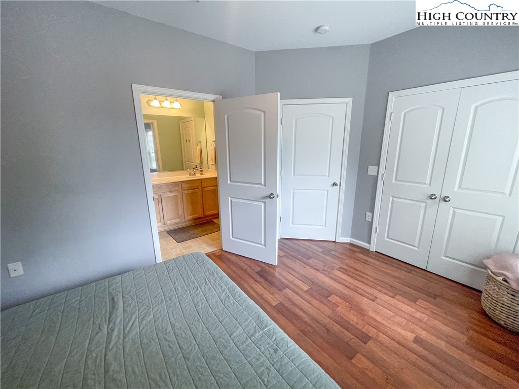 190 Eli Hartley Drive, Unit 112 Boone, NC 28607 - Photo 16 of 20 a view of an empty room with wooden floor and a window