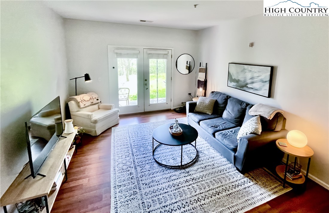 190 Eli Hartley Drive, Unit 112 Boone, NC 28607 - Photo 6 of 20 a living room with furniture rug and window