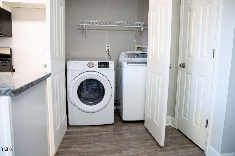 141 Jones Franklin Road, Unit E Raleigh, NC 27606 - Photo 7 of 20 a utility room with washing machine and a view of a utility room