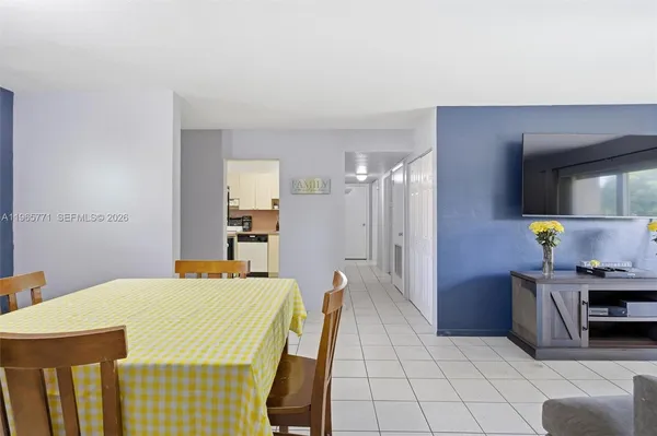 a dining room with a table and chairs