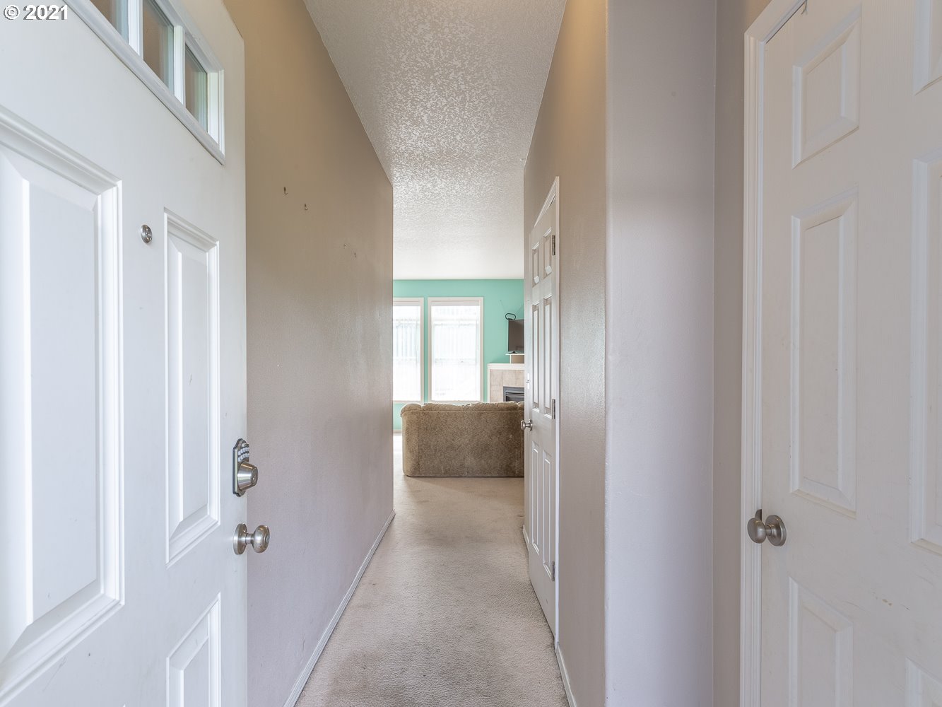 3123 South 2nd Street Ridgefield, WA 98642 - Photo 3 of 32 a view of a hallway with wooden floor and windows
